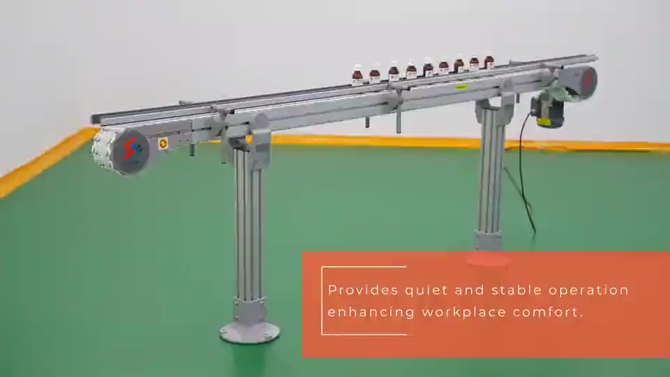 A straight conveyor on aluminium legs carrying a line of small bottles